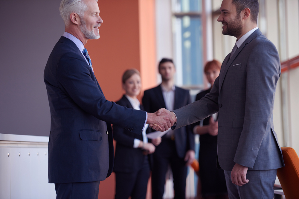 business partners, partnership concept with two businessman handshake business partners, partnership concept with two businessman handshake